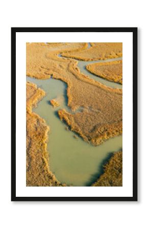 Looking down at a wetland at sunrise.