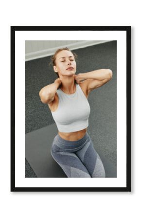 Woman stretching her neck before yoga