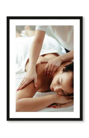 Young woman making massage at spa center