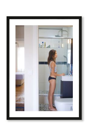 Woman in bathroom morning beauty routine