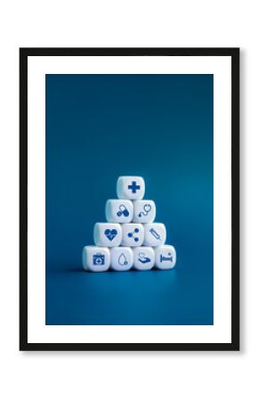 Healthcare medical, wellness plan and insurance concept. Health, care, hospital service and medical element icon symbols on clean white blocks stacking arranged pyramid shape on blue background.