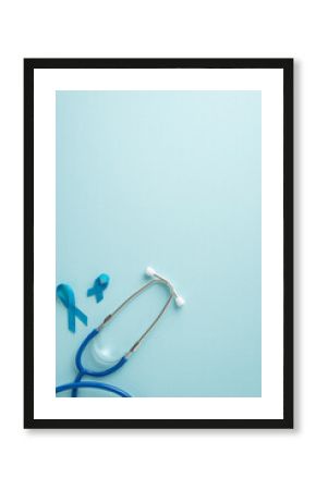 Emphasize importance of men's health month with top view vertical image displaying blue ribbons and a stethoscope for health examinations on a pastel blue background, offering space for text