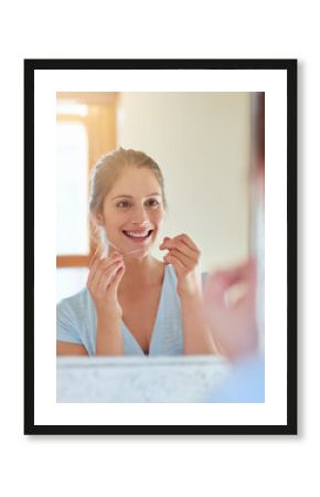 Mirror, reflection and woman with floss in bathroom for dental care, gum health and wellness. Happy girl, plaque remove and tooth product for benefits, oral hygiene or prevention of cavities at home