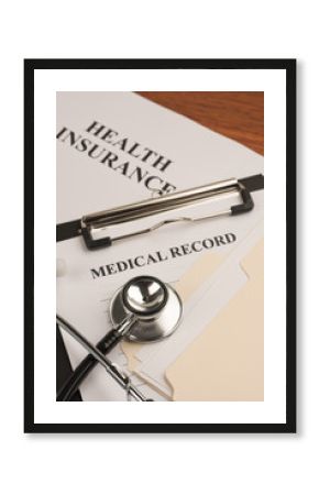 Doctor's stethoscope, medical record and health insurance policy