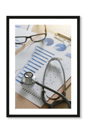  financial report chart and calculator Medical Report and stethoscope