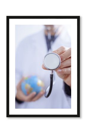 doctor man with a stethoscope and a world globe.