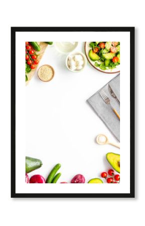 Preparing fresh salad. Vegetables, greens, spices on white background top view copy space frame