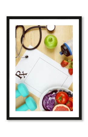 Prescription for good health overhead with stethoscope, healthy fresh food and exercise equipment, with copy space.