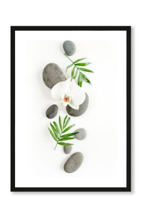 Spa stones, palm leaves, flower white orchid and zen like grey stones on white background. Flat lay, top view