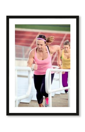 Athletes running up bleachers
