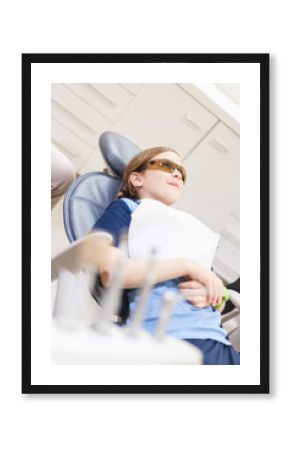 Tween girl lying in a chair at the dentist