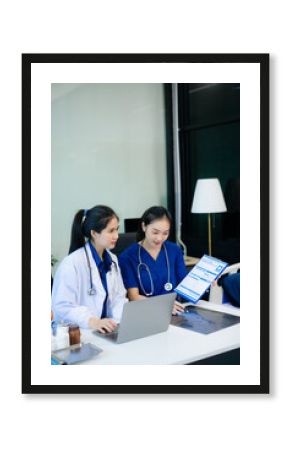 Medical professionals brainstorming with laptop in hospital office for health planning, research, and management.