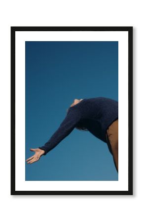 Person Reaching Big Blue Sky in Relaxed Pose