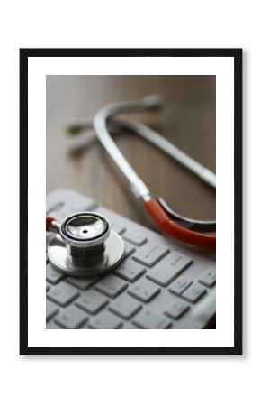 Stethoscope on Keyboard Symbolizing Telemedicine and Healthcare Technology Integration