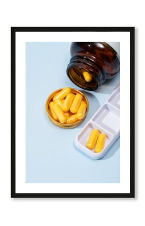 Top view of medical pills in a bottle and organizer