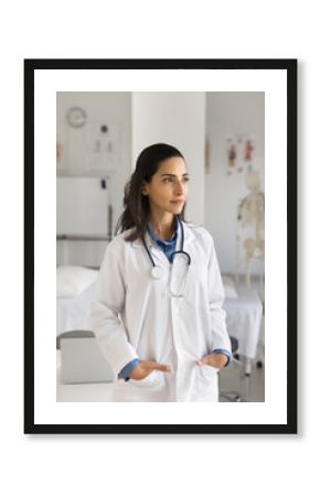 Forward thinking doctor. Pensive confident pretty young girl medical professional in white coat stand in office look aside contemplate on new ideas in healthcare visualize future career in medicine