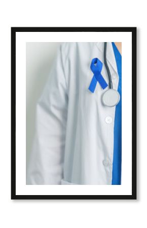 March Colorectal Cancer Awareness month, doctor with dark Blue Ribbon for supporting people living and illness. Healthcare, hope and World cancer day concept