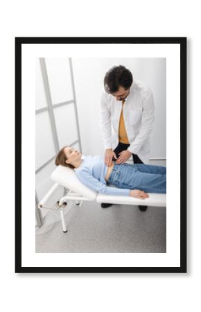 Female patient with belly pain side came to see a doctor to check-up health of her internal organs, such as stomach, liver, gallbladder, pancreas and intestines