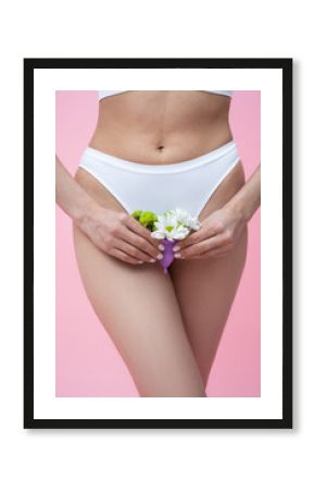 Female wearing absorbent underwear representing menstrual health care holding floral menstrual cup