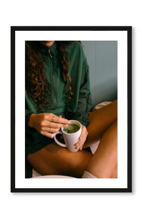 young woman holding matcha tea