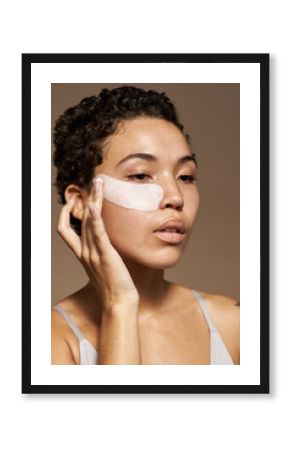 African American woman with cosmetic patches on face