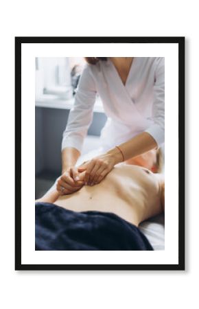 Manual therapist neurologist, chiropractor with patient. Massaging, relaxing, health care procedure for patient