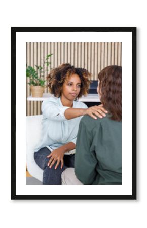African American female psychologist conducts an appointment with a patient in the office. mental health and moral support. woman is a patient with mental difficulties and a mental disorder