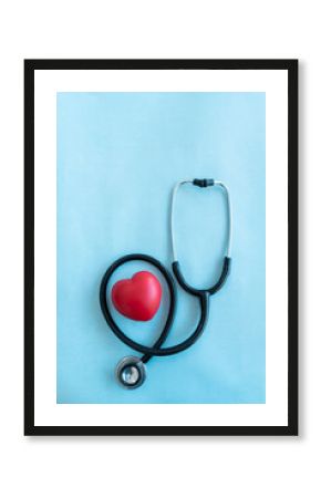 Statoscope with red heart shape isolated on light blue background with copy space for text, Medical and health care concept image