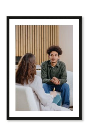 young man in consultation with psychologist is taking care of mental health. Psychotherapy for treatment of disorders and depression, insomnia. African American guy tells doctor about his problems