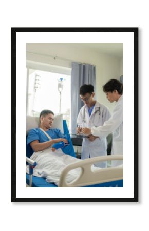 An Asian male patient lies in a hospital bed and is carefully looked after by a doctor. Doctor giving advice to male patient Working on health disease diagnosis
