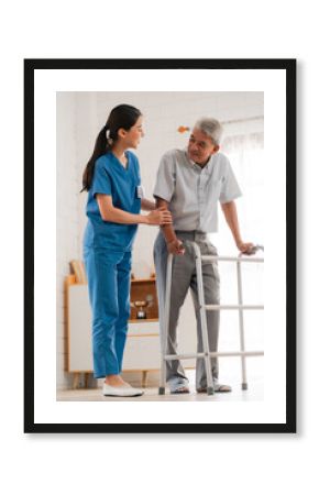 Asian physiotherapist nursing home to support old senior man patient therapy by walker, caregiver nurse help recovery health care with elderly retirement man person at home, health insurance concept