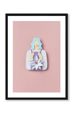 Colorful handmade paper woman holding white paper flower