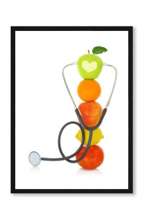 Stethoscope with fresh fruits isolated on white