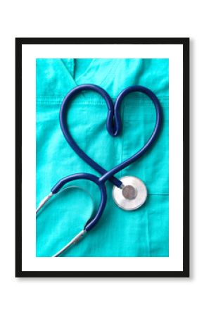 A stethoscope shaping a heart and a clipboard on a medical uniform, closeup