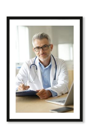 Doctor in office working on patient file