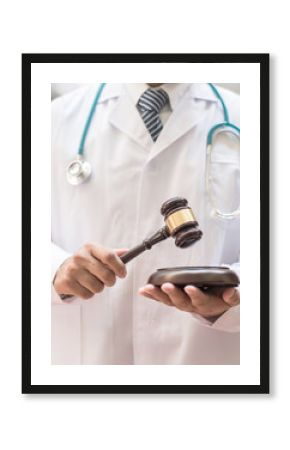 Forensic medicine legal investigation or medical practice - malpractice justice concept with judge gavel in doctor's hands 