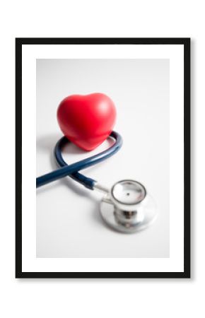 Red heart with stethoscope on white background