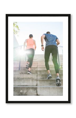 Hispanic Couple Running or Jogging Together Outdoors.