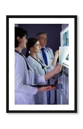 Hospital doctors looking at x-rays in an emergency room