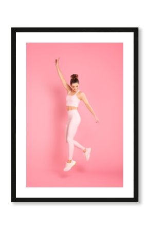 Sporty woman exercising in studio.