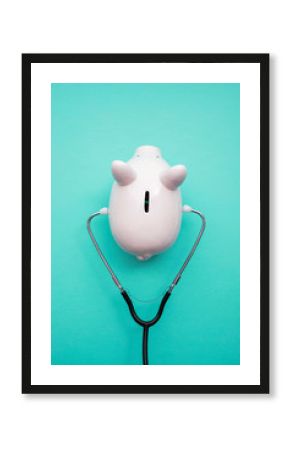 Cost of healthcare. Piggy bank money box with a medical doctors stethoscope