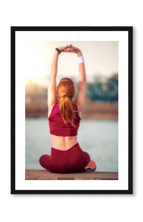 Woman stretching outside.