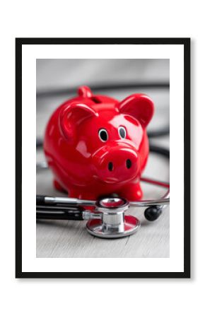  Red piggy bank and stethoscope symbolizing health savings, medical insurance planning, and financial wellness for healthcare