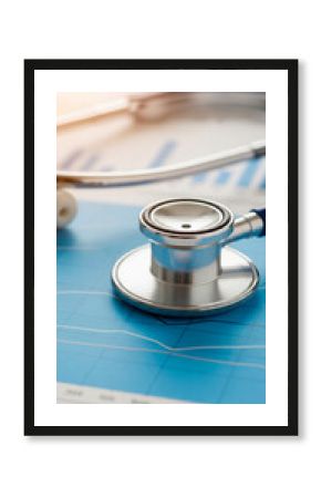Close-up of stethoscope on blue graph, showcasing medical data analysis, symbolizing healthcare analytics, research, or financial health of medical business