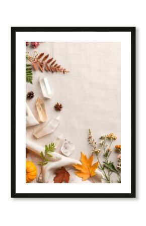 Vibrant flat lay of fall leaves and flowers on a cotton background with natural hues