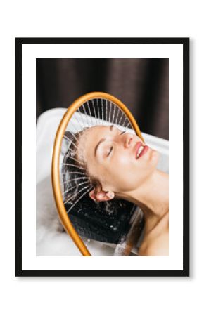 Woman enjoying hydromassage therapy with soothing water jets, relaxing in a spa environment, experiencing rejuvenating aqua massage for ultimate relaxation and wellness benefits