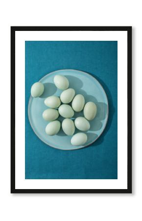 Blue eggs on blue  linen surface
