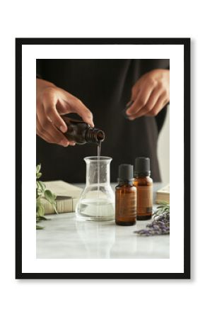 Woman crafting natural cosmetics for aromatherapy, pouring essential oil into bottle with lavender flowers and herb. Holistic medicine, wellness therapy. Homemade beauty gift idea.