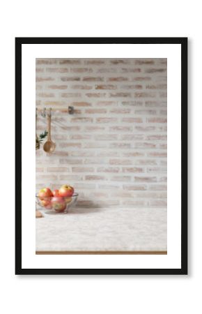 A showcasing space on a white marble tabletop against the brick wall in a Scandinavian kitchen.