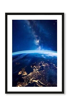 Stunning aerial view of Europe at night from space with bright city lights and a star-filled sky. Space photography concept